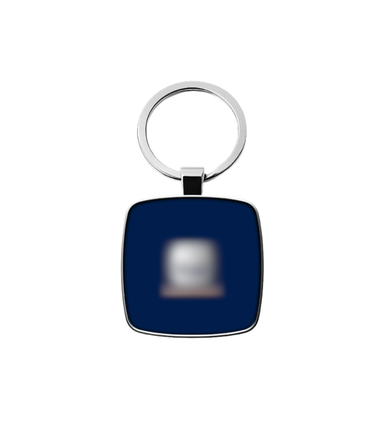 A metal keyring with the client logo blurred out, the physical object that carries the QR code.